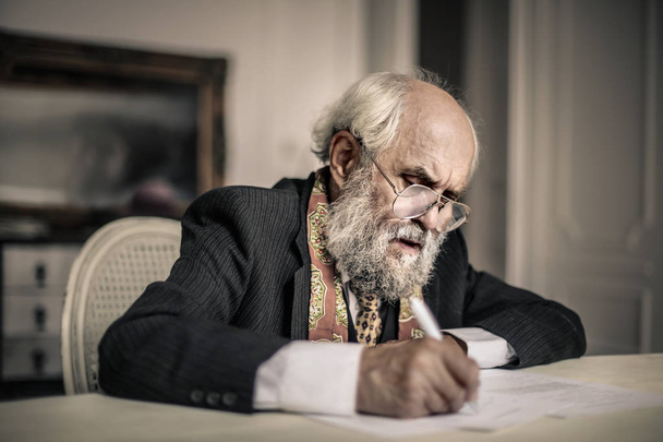 Old man writing   - Valokuva, kuva