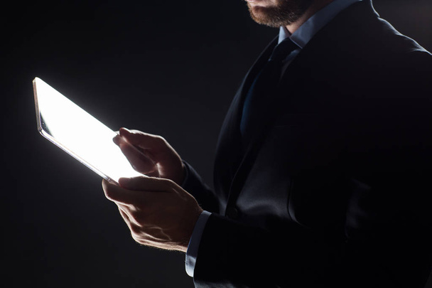 close up of businessman with transparent tablet pc - Zdjęcie, obraz