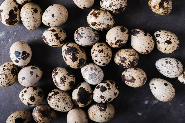 Quail eggs on a gray background.  Eggs.  Easter photo concept. Copyspace  - 写真・画像