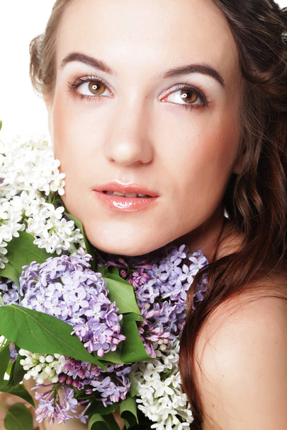 young beautiful woman with lilac flowers - Zdjęcie, obraz