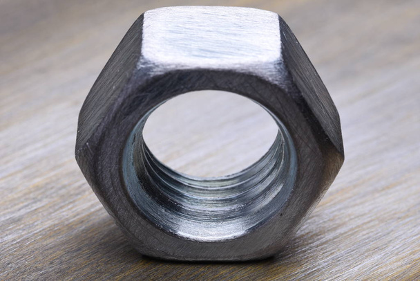 Single Steel Nut on Metal Background Closeup - Photo, Image