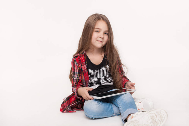little student girl with tablet pc doing homework - Φωτογραφία, εικόνα