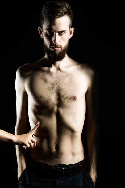 slim bearded man with thin bare torso isolated on black - Foto, afbeelding