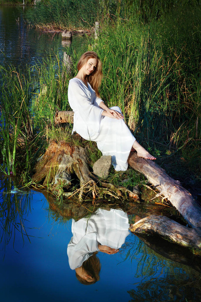fairy woman near forest lake - Fotoğraf, Görsel