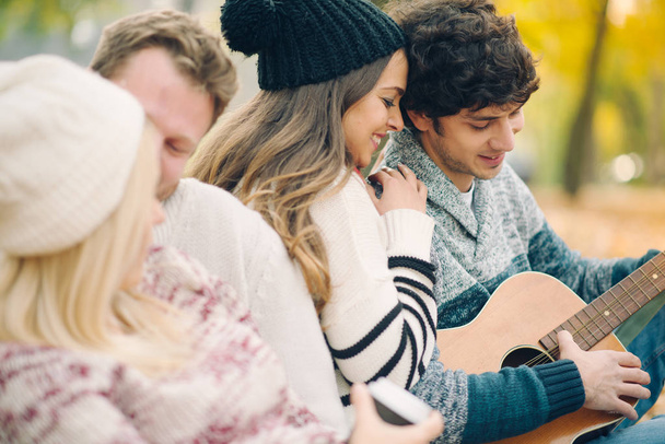 Friends playing guitar outdoor  - Photo, Image