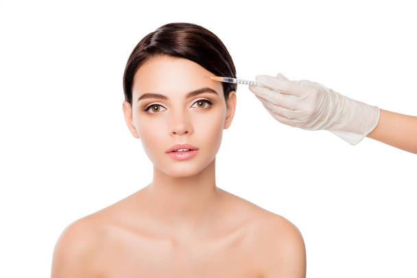 Plastic surgery concept. Botox injection in woman's eyebrow - Φωτογραφία, εικόνα