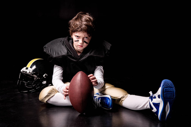 Boy playing american football - Valokuva, kuva