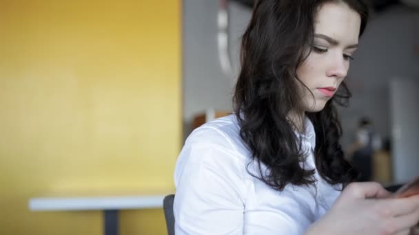 Modern generation. Woman using smartphone in cafe. - Metraje, vídeo