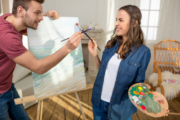 Young couple painting together - Photo, Image