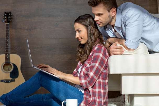 Young couple using laptop - Photo, Image