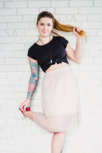 Young tattooed woman - Фото, изображение