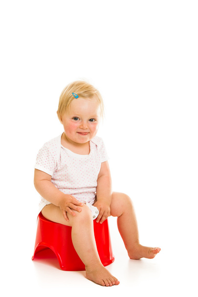 Toddler girl potty trainting isolated on white - Foto, Bild