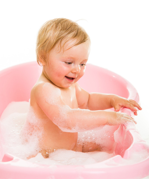 Cute infant girl in bath isolated on white - Fotografie, Obrázek