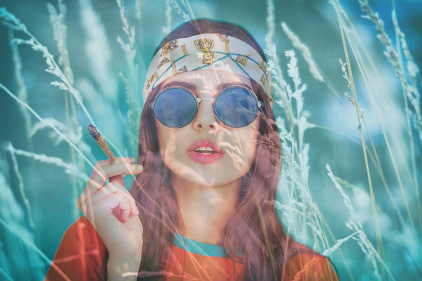 Double exposure of beautiful hippy girl smoking weed and field - Foto, afbeelding