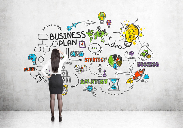 Woman in skirt and colorful business plan - Photo, image