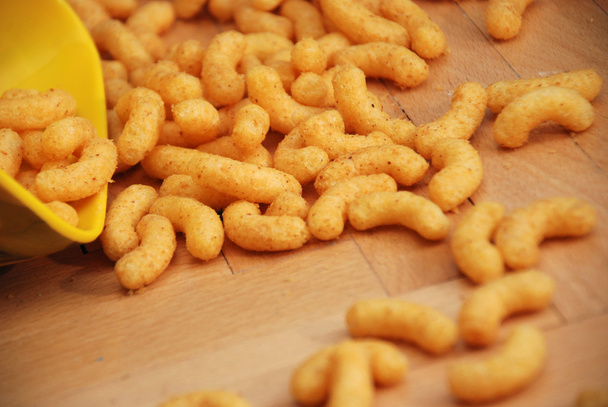 Corn puffs,snaks on the floor - Photo, Image