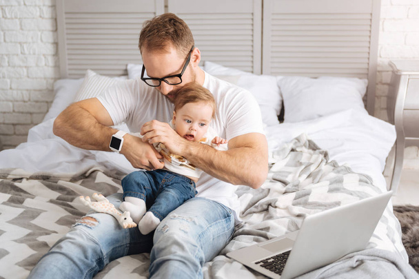Modern father expressing care to his little child at home - Valokuva, kuva
