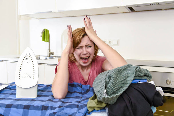 angry woman or crazy busy housewife ironing shirt lazy at home k - 写真・画像