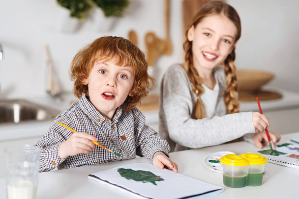 Excited talented siblings drawing some greens - Foto, Bild