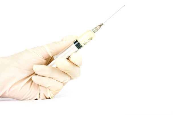 syringe in a hand - Фото, зображення