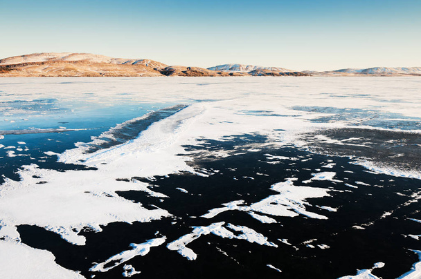 Ice and snow on the frozen lake.  - Fotografie, Obrázek