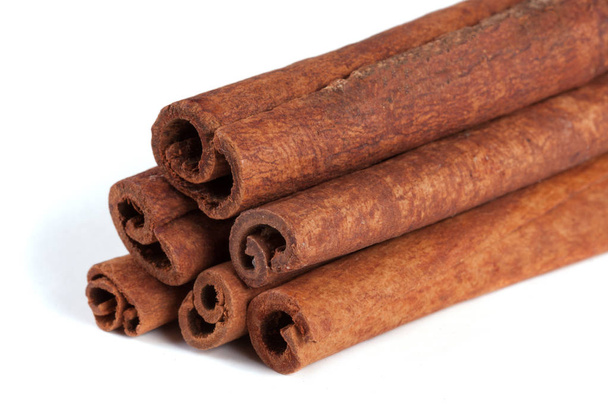 a stack of cinnamon sticks isolated on white background - Photo, Image