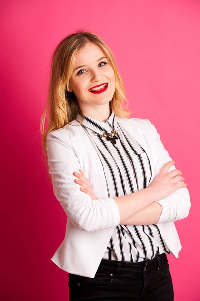 young business woman in white and black dress over pink backgrou - Valokuva, kuva