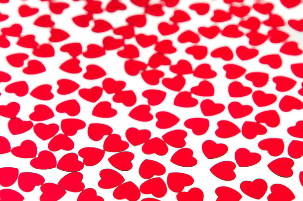 Valentines day pattern of red hearts confetti on white background. - Zdjęcie, obraz