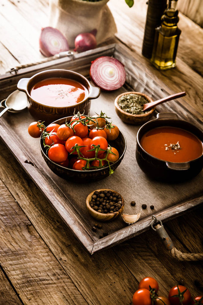 Tomato soup on wood - Foto, afbeelding