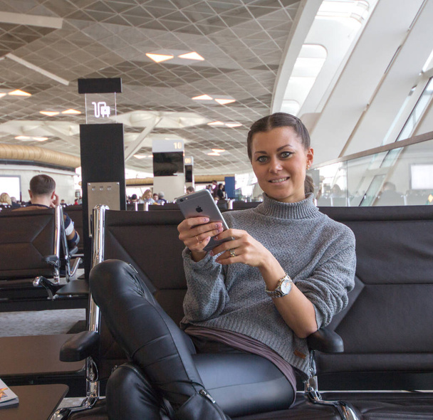 Woman Sitting In Airport Lounge - Photo, image