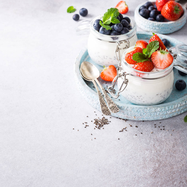Chia pudding with berries in glass jar. - Photo, Image