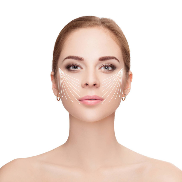 Spa portrait of woman with arrows on her face on white backgroun - Фото, изображение