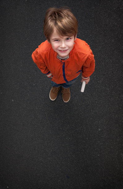 Cute Boy, with Chalk on Street/Tarmac - Фото, изображение