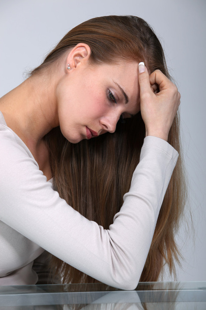 Picture of woman in profile looking depressed - Фото, зображення