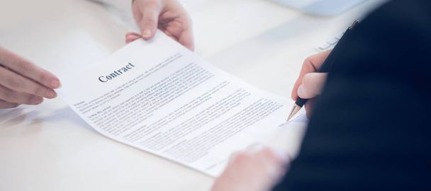 Businessman signing a contract - Фото, изображение
