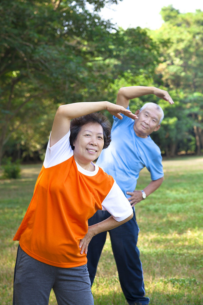 Happy asian senior fitness couple in the park - Photo, Image