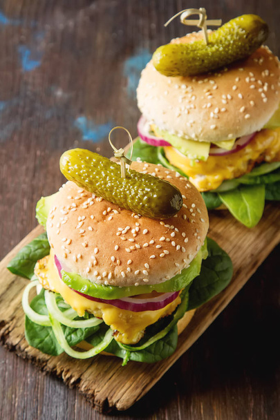 Fast food. Vegetarian burger with a chop, cucumber, tomato and l - Zdjęcie, obraz