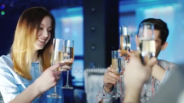 Group of friends drinking wine in a restaurant or cafe, clink glasses. Positive emotions and a good time - Felvétel, videó