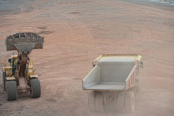 dumper truck driving around in a porphyry rock mine - Photo, Image