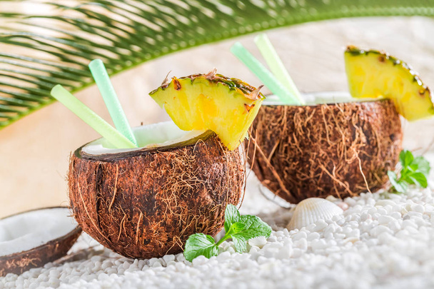 Sweet pinacolada in coconut in sunny day - Foto, afbeelding
