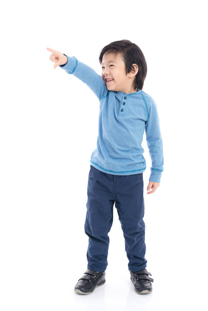 Asian child pointing on white background isolated - Fotoğraf, Görsel