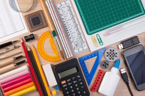 Desk with school stationary or office tools. Flatlay set of artist school stationery studio shot on school table background. School equipment concept. - Photo, Image