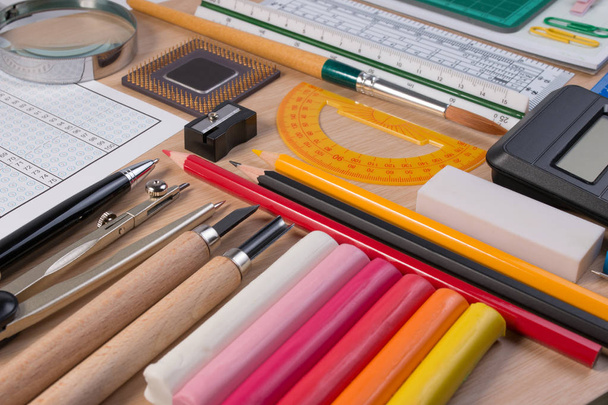 Desk with school stationary or office tools. Flatlay set of artist school stationery studio shot on school table background. School equipment concept. - Photo, Image