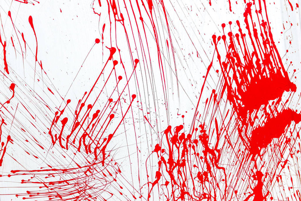 Blood splatter, red acrylic paint splash isolated on wall background texture - Photo, Image
