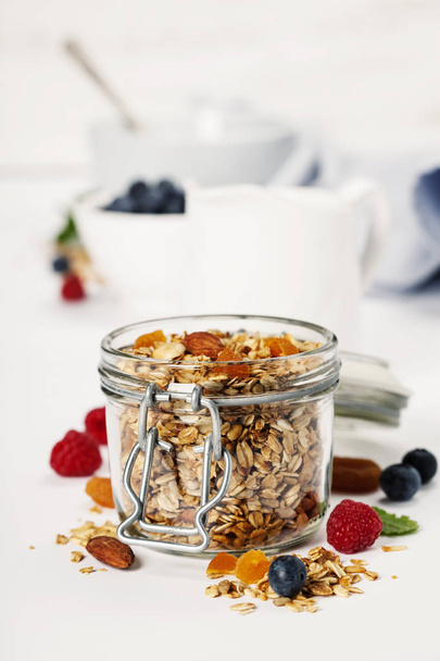Healthy breakfast -  Homemade granola, honey, milk and berries - Valokuva, kuva