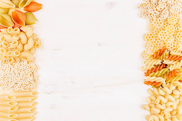 Pasta background decorative border of assortment different kinds italian macaroni. - Foto, Imagen