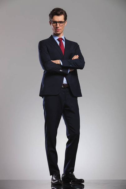 confdent business man standing with hands crossed - Photo, Image