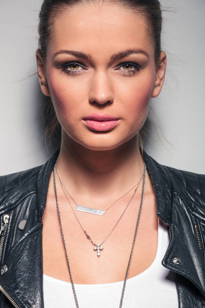 closeup portrait of a young woman in leather jacket - Фото, зображення