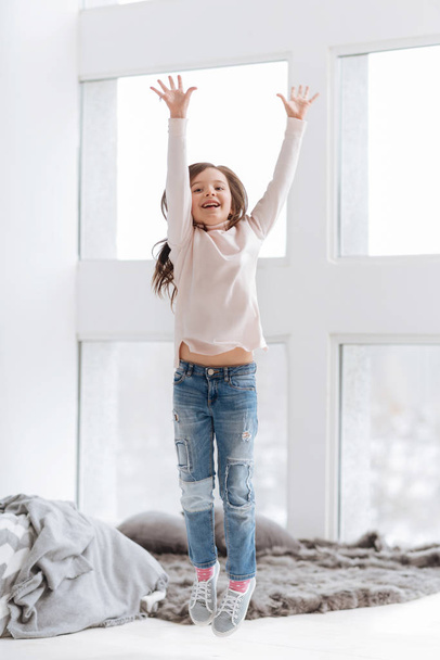 Happy positive girl holding her hands up - Фото, изображение