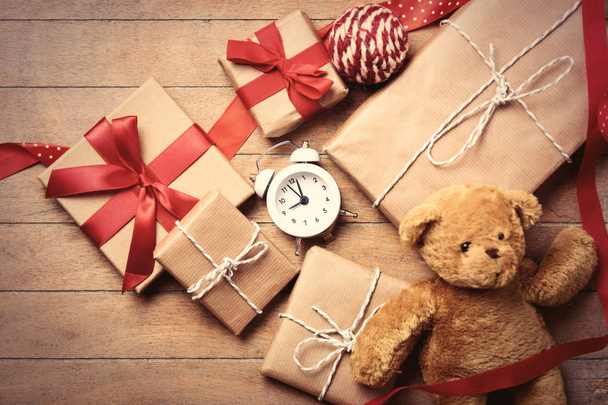 gifts, teddy bear, ball, ribbon and clock - Photo, Image
